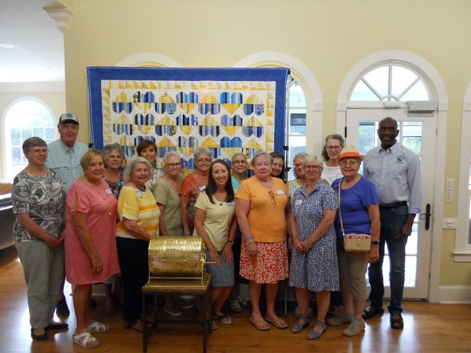 The Sea Island Quilters with their “Hearts for Ukraine” project which was raffled as a fundraiser for the city of Ostroh, Ukraine.